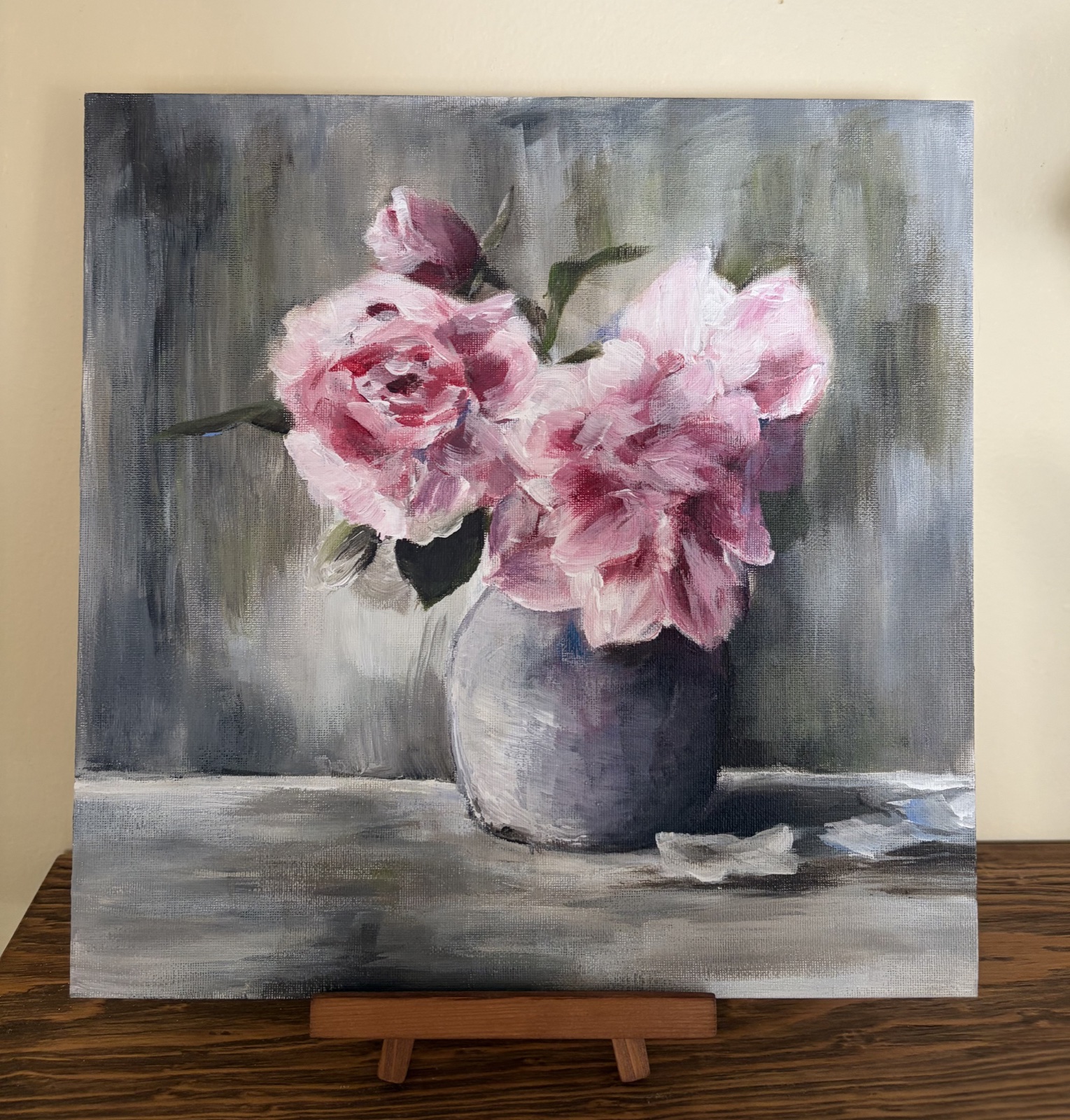A student painting of pink flowers in a vase